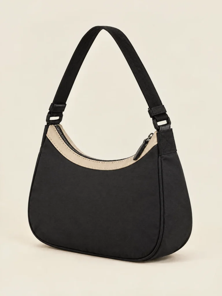 Arc Shoulder Bag side view showing baguette shape and short strap