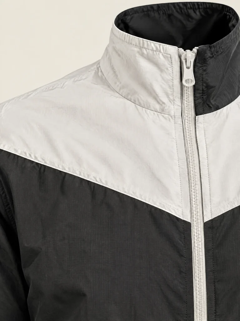 Close-up of Corner Stand-Collar Jacket collar and Chalk zip tape detail