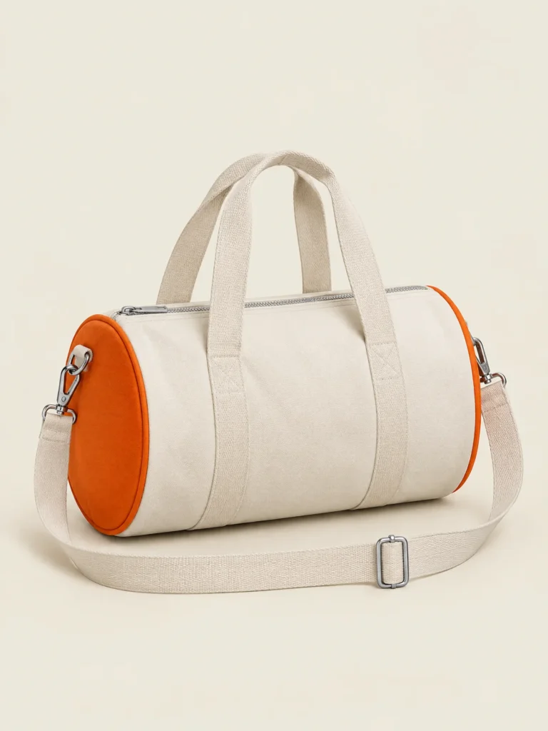 Mini Barrel Bag in Chalk with Signal orange circular end panels, front view