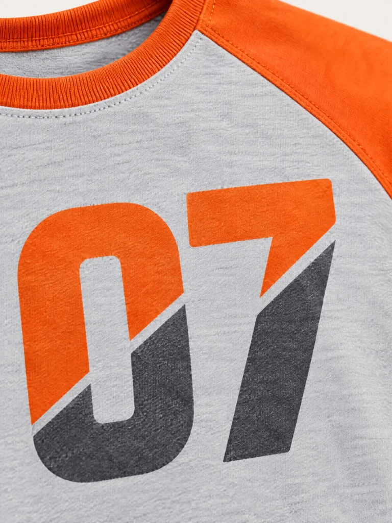 Close-up of split 07 graphic and raglan sleeve seam detail