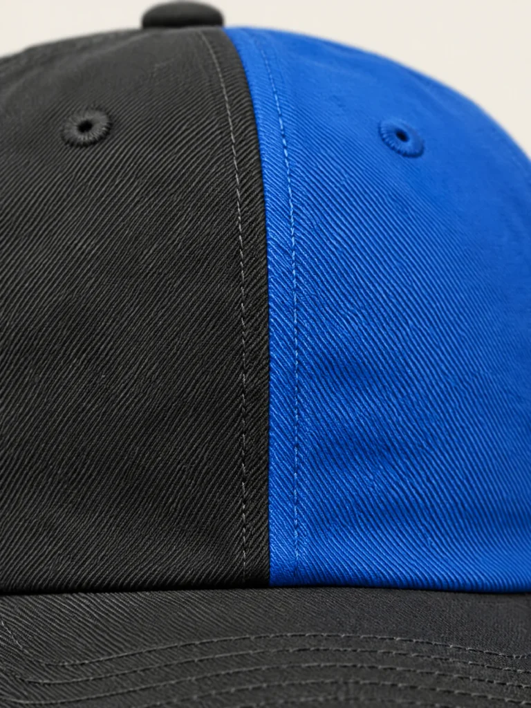 Close-up of Split Panel Cap crown split, Asphalt and Lane Blue panels