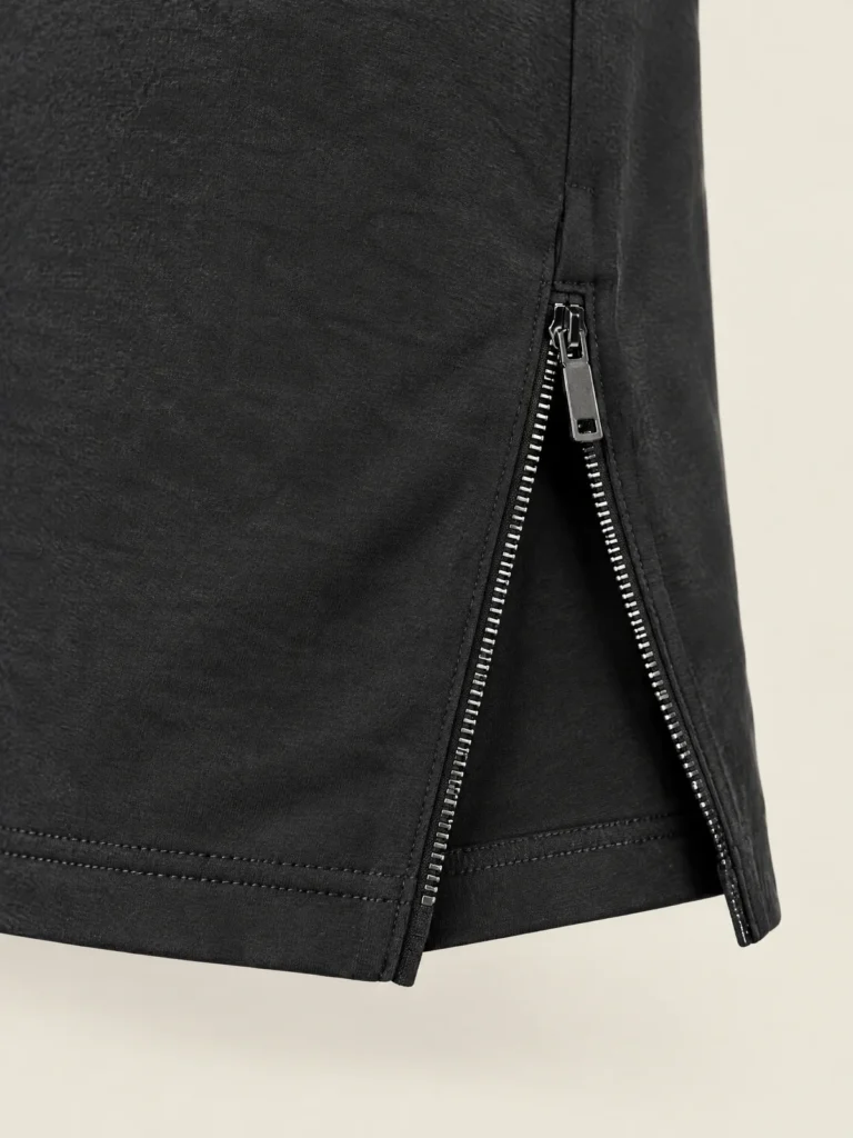 Close-up of side-hem zip detail on Tempo Two-Way Zip Top